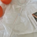 Detail of glass straw with cute blue cloud and yellow sun prints on a white background - Blue Sky White Clouds