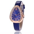Detailed macro view of a rose gold snake-head watch dial with sparkling crystal bezel - Blue