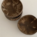 Close-up of stacked natural coconut bowls showing polished texture and organic wood grain - Coconut Bowl