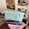 Light blue canvas pencil case with cartoon embroidery and spacious storage design - Blue