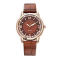 Detailed close-up of brown crocodile pattern leather strap and rose gold quartz watch - Brown