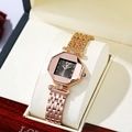Detail of rose gold octagonal watch with black dial and diamond accents on cushion - Black