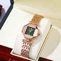 Detailed view of women's octagonal rose gold watch with green dial and diamond accents - Green