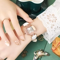 Octagonal rose gold watch with white leather strap on female wrist with lace sleeve - White