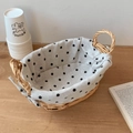 Detail of a woven storage basket with black and white polka dot lining and handles - Black White Polka Dot