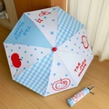 Foldable umbrella detail with star and apple patterns and a matching zippered carry case - Apple Cat