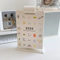 Cremeweißer Tischkalender 2026 mit bunten Symbolen und minimalistischem Sockel - Weiß
