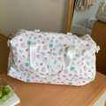 Macro detail of cartoon cat pattern on large travel duffel bag with front zipper pocket - Cat Print Style