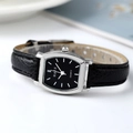 Elegant tonneau-shaped quartz watch with black dial and leather strap on white background - Black Strap Silver Case Black Dial