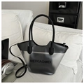 Close-up of translucent matte gray tote bag with black MEIXIAOMEI lettering on white sofa - Matte Black