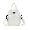 White canvas crossbody bag with top handles and adjustable strap featuring smile logo - White