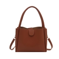 Brown vintage style bucket bag for women with top handle and adjustable strap in white background - Brown