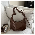 Detail of dark brown PU leather crescent bag with pleated handle and branded lettering - Brown
