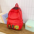 Durable red canvas backpack for students featuring unique embroidered patches and large capacity - No Pendant / Red