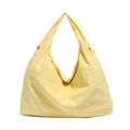 Light yellow large nylon hobo bag with adjustable drawstring detail on white background - Yellow