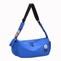 Royal blue nylon messenger bag with colorful badges and adjustable black strap - Blue