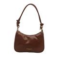 Bruine lakleren baguette tas met geknoopte schouderband en gouden belettering - Bruin