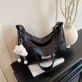 Black half-moon hobo bag with a plush cloud charm and minimalist logo patch - With Pendant / Black