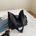 Minimalist black canvas tote bag with fashion label and thick strap in casual style - Black Without Charm