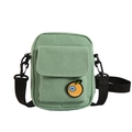Cute light green canvas crossbody bag for women with an orange badge and wide black strap - Green