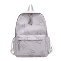 Sac à dos violet clair avec imprimé papillons, poche avant zippée et poches latérales - Gris