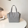 Minimalist grey corduroy tote bag for commuting displayed on a white table - No Pendant / Gray