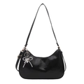 Glossy black leather hobo shoulder bag with a silver beaded bow charm on a white background - Black