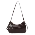 Deep brown crescent shoulder bag in glossy leather with a silver bow pearl charm - Brown