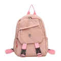 Light pink waterproof nylon backpack with adjustable straps and front buckle closure - Pink
