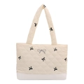 Chic quilted beige tote bag with black bow embroidery and metallic bow charm detail - White