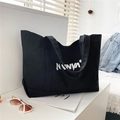Große schwarze Canvas-Einkaufstasche mit NVNVN-Schriftzug und dickem Schultergurt für Damen - Schwarz