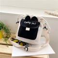 Süße cremeweiße Canvas Beuteltasche mit Hasenohren und Chong Ya Aufdruck für Damen - Schwarz