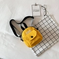 Bright yellow canvas mini crossbody bag with black strap and CMN print detail - Yellow