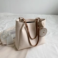 Cream white embossed tote bag with cartoon patterns and cute bear charm pendant - White & Khaki