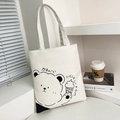White canvas tote bag featuring a minimalist cartoon bear print and cute Japanese text - White Type 1