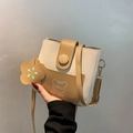 Crossbody bucket bag in beige and camel featuring a cute cartoon bear print and wood button - Yellow