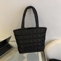 Minimalist black quilted puffer tote bag with large square stitching for daily commuting - Black