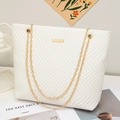 White quilted tote bag with V-shaped stitching and golden chain straps for women - White