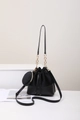 Sac seau noir en daim et cuir lisse avec bandoulière chaîne et mini pochette ronde zippée - Noir