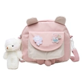Cute pink and white crossbody bag for girls with cartoon patches and plush bear charm - Pink