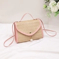 Pink straw crossbody bag with pearl pendant and adjustable leather shoulder strap - Pink