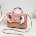 Dusty pink crossbody bag with quilted pattern and colorful scarf wrap on handle - Pink