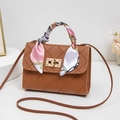 Chic brown quilted crossbody bag with silk scarf handle and gold buckle detail - Brown