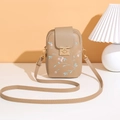 Close-up of beige crossbody phone bag featuring floral embroidery and gold metal clasp - Khaki