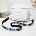 White quilted crossbody camera bag with wide woven strap and gold metal detailing - White