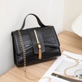 Black crocodile pattern handbag with gold fringe hardware and chain shoulder strap - Black