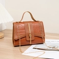 Brown crocodile pattern crossbody bag with tassel detail and golden chain strap - Brown