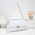 Minimalist white baguette shoulder bag with gold square buckle in a chic setting - White
