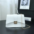 White faux leather handbag with crocodile pattern and golden chain shoulder strap - White