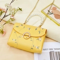 Yellow pearl handle crossbody bag with floral embroidery and gold chain strap - Yellow